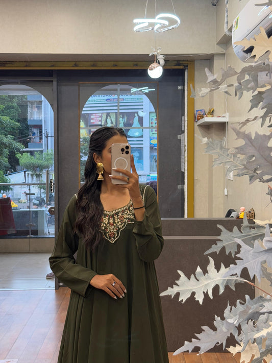 Elegant Green Embroidered Ethnic Dress with Golden Earrings
